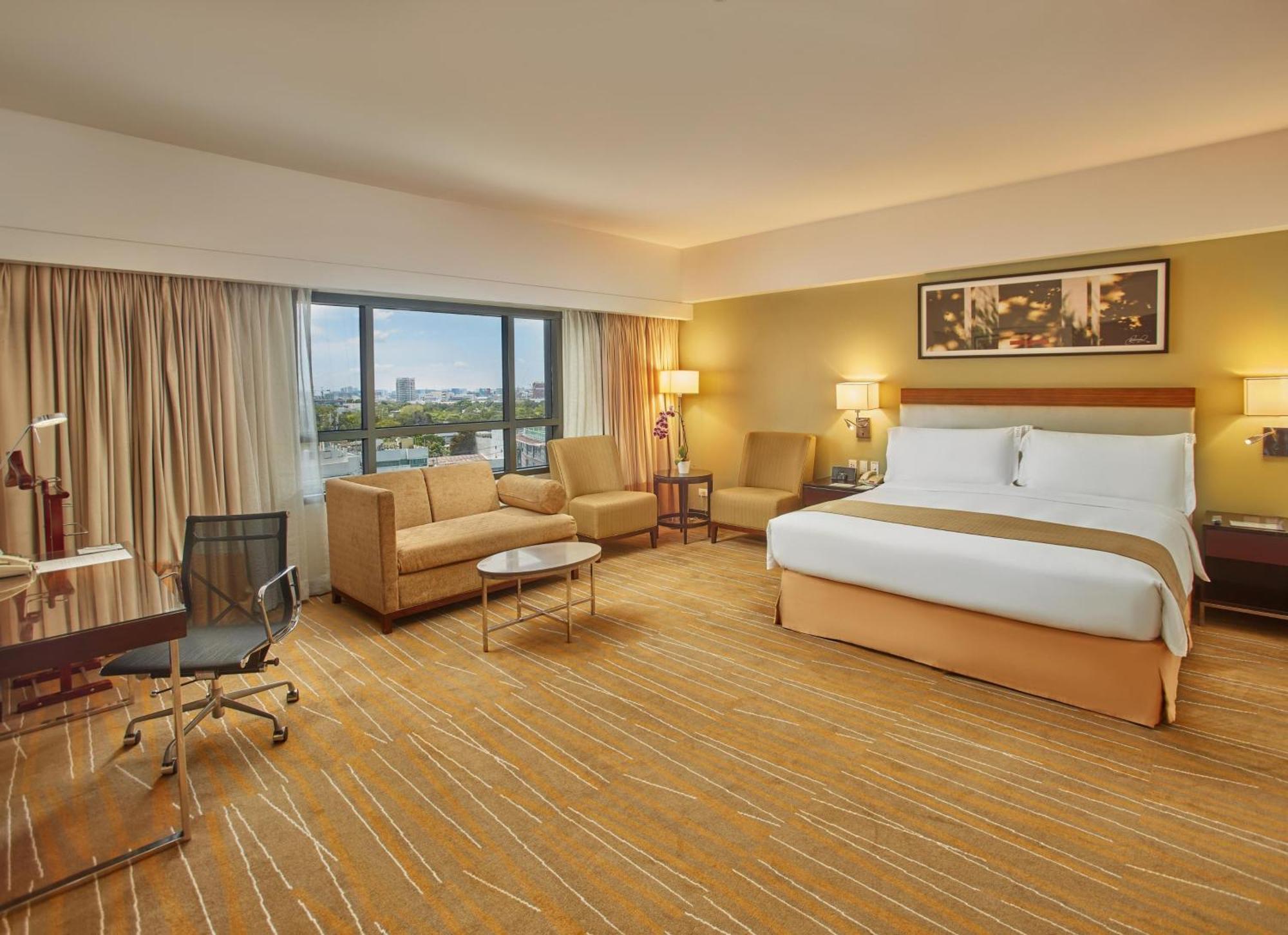 فندق هوليداي إن آند سويتس ماكاتي المظهر الخارجي الصورة Deluxe Room